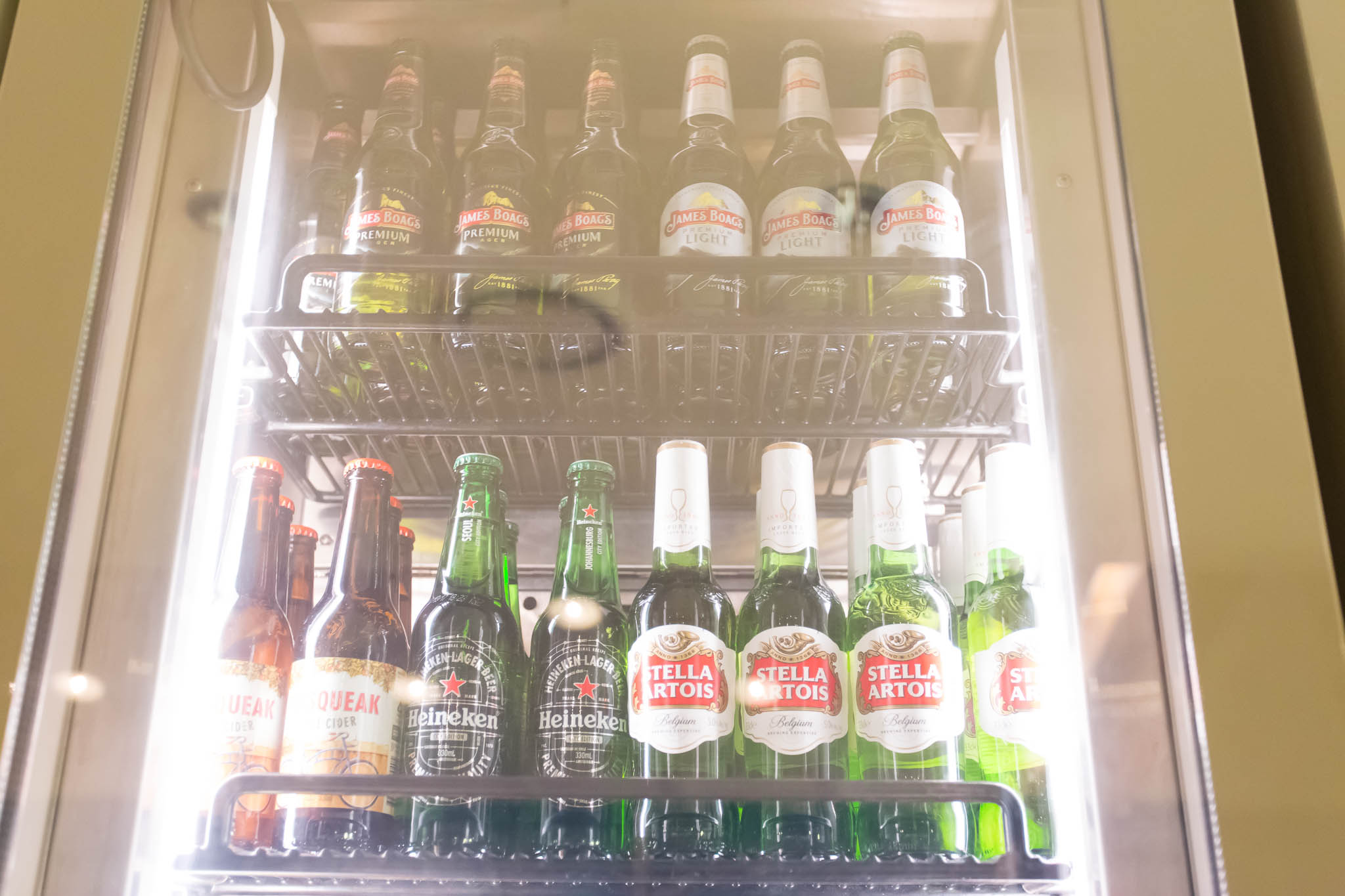 a shelf of beer bottles